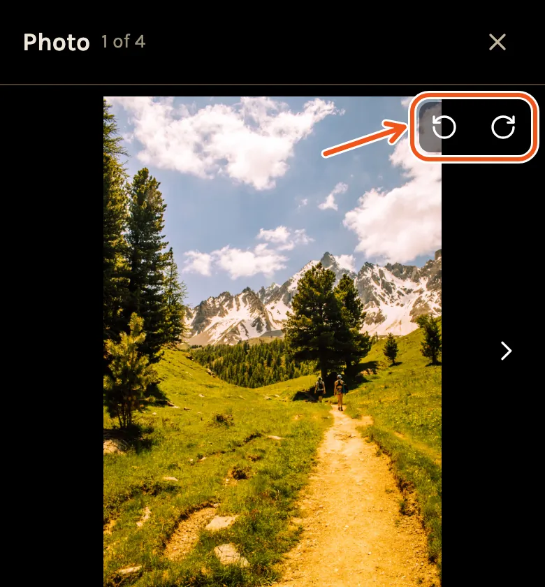 A photo open on a phone, with the two rotate arrows at its top right marked.