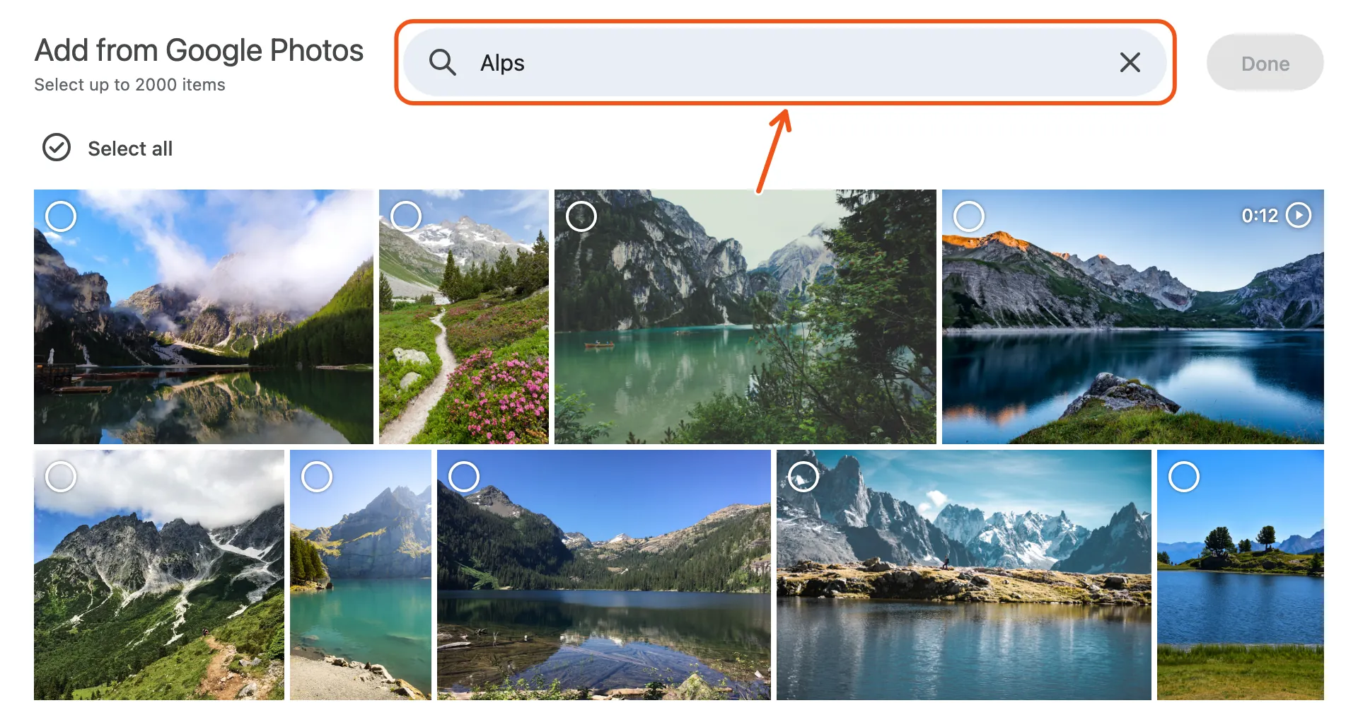 Google's picker with the search box marked, searched for Alps, showing mountain and lake photos.