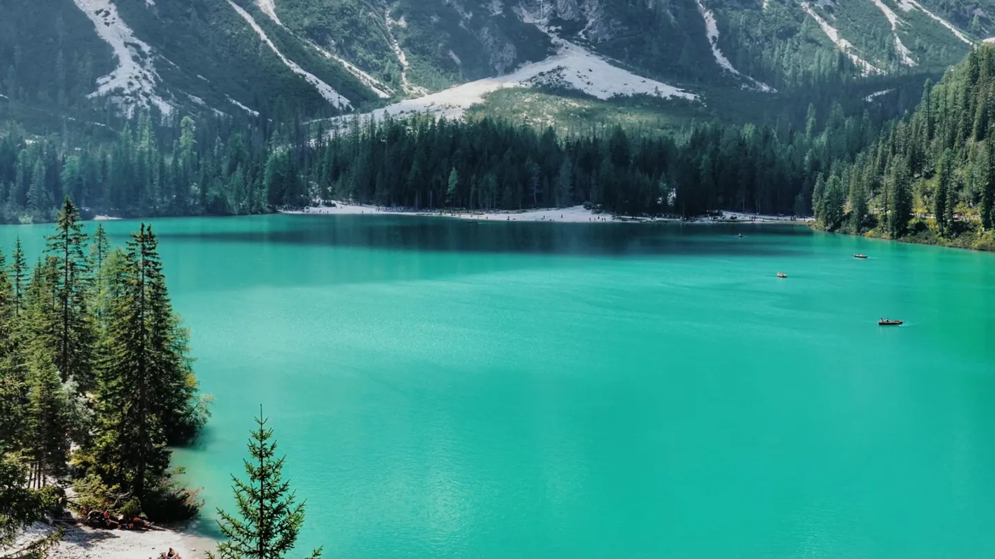 A frame from a finished film: a photo of a turquoise mountain lake filling the screen.